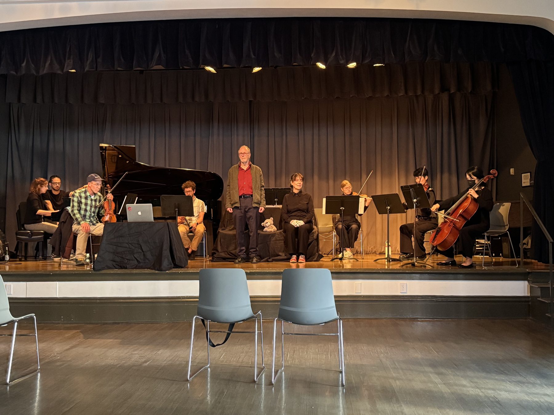 Wide shot of the full company on stage