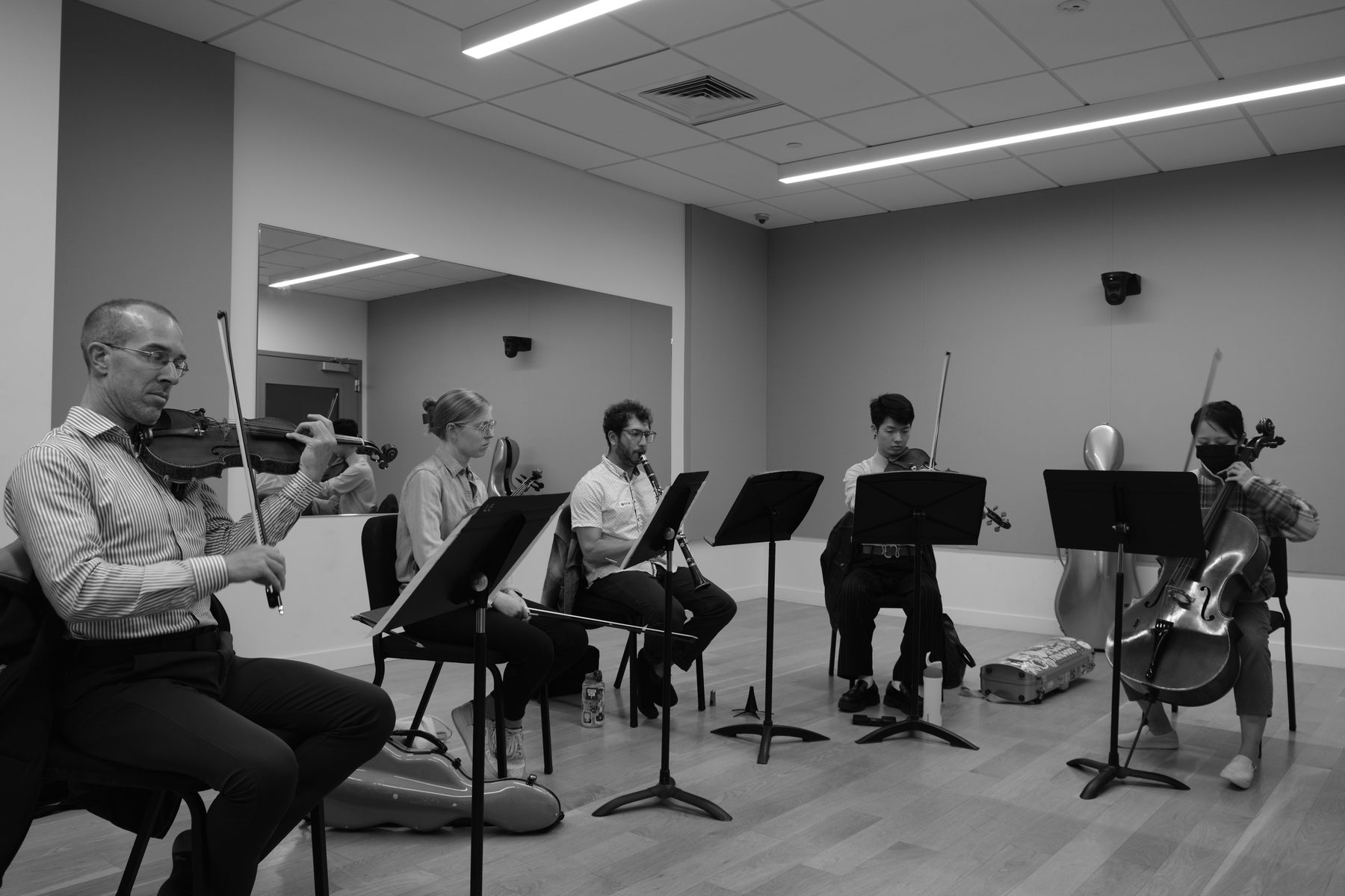 The six musicians in rehearsal, black and white